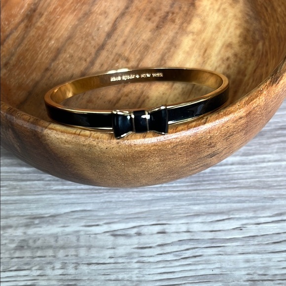 Kate Spade Elegant Black and Gold Bow Bracelet - Picture 1 of 4